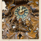 Close-up of hand-carved leaves and bird family on the nest | Montag Steins & Clocks
