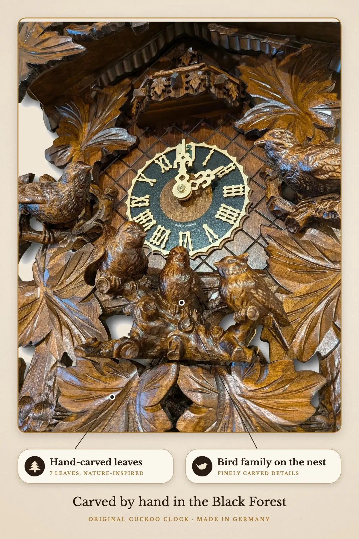 Close-up of hand-carved leaves and bird family on the nest | Montag Steins & Clocks