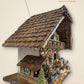 Side view with handmade wooden roof shingles, 38 x 35 x 25 cm, automatic night shut-off | Montag Steins & Clocks