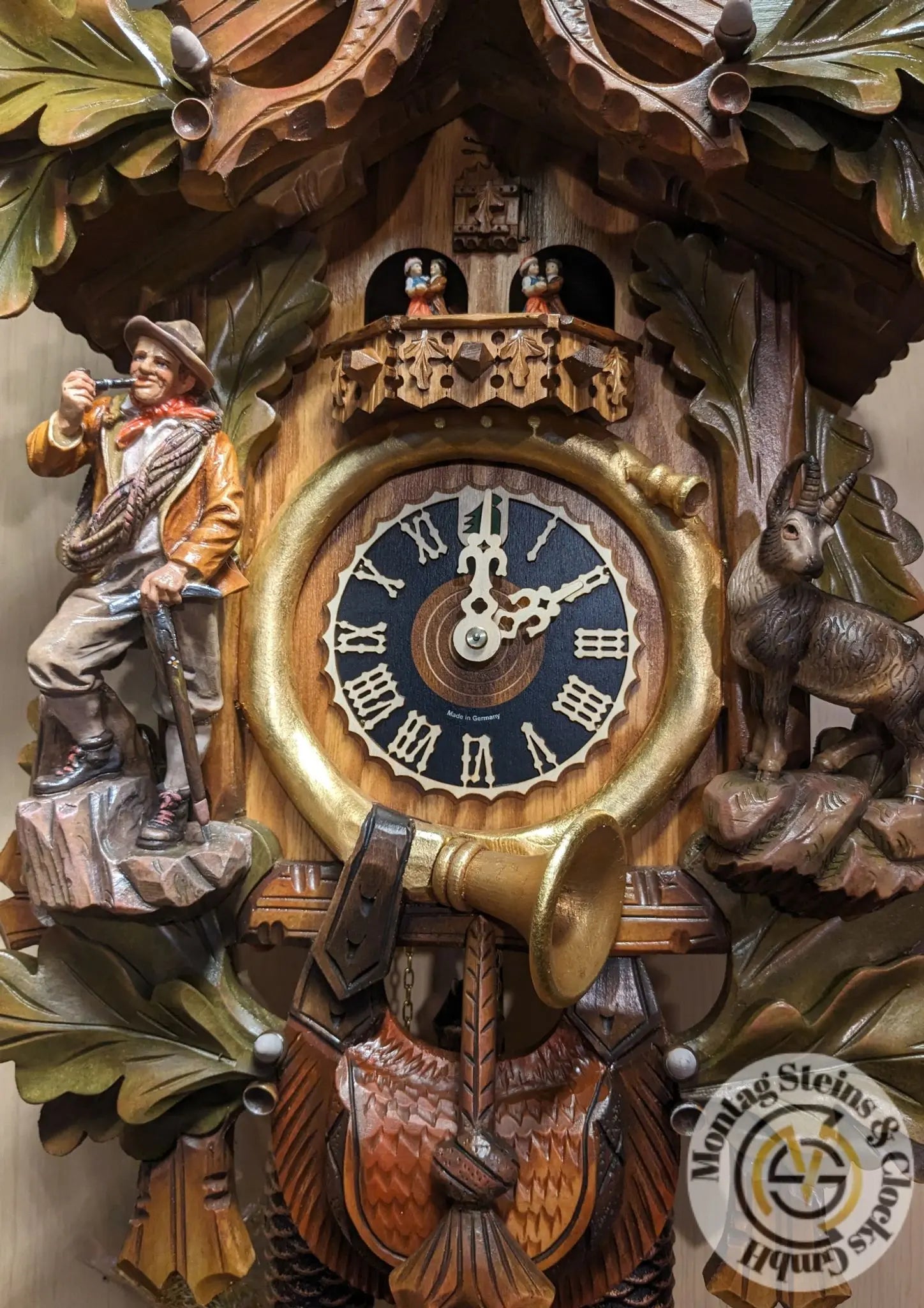 Climber with eagle colorful 8 day cuckoo clock with music Hoenes