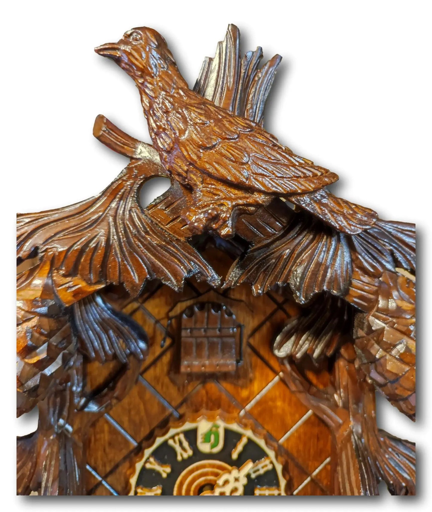 Reloj de cuco de piña de color oscuro con dos pájaros