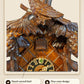Hand-carved bird in dark stained wood | Montag Steins & Clocks